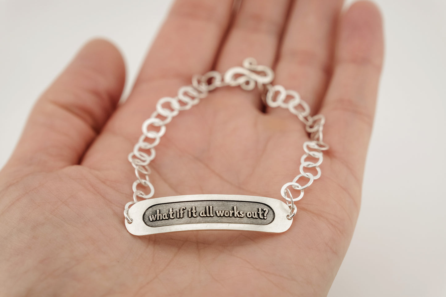 Bracelet, Embossed "What if it all works out?" Sterling Word Bracelet